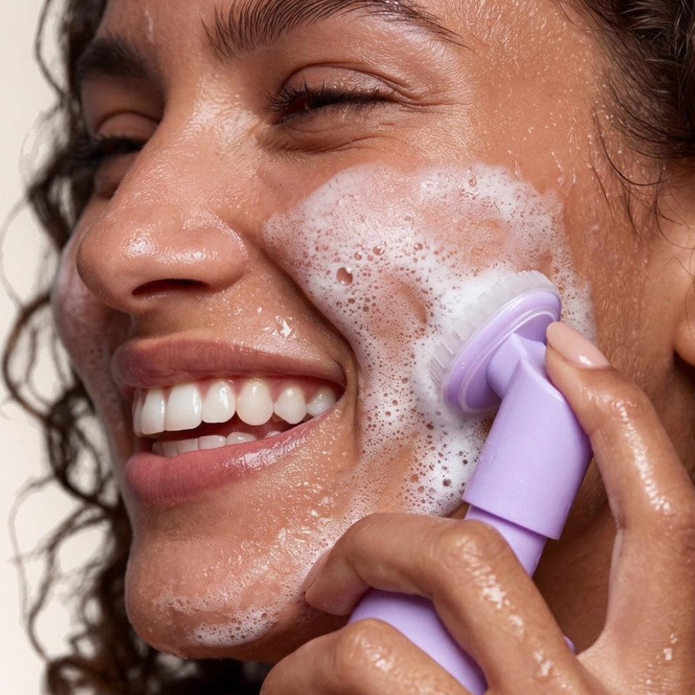 Woman cleansing her face with MUSE Travel cleansing foam